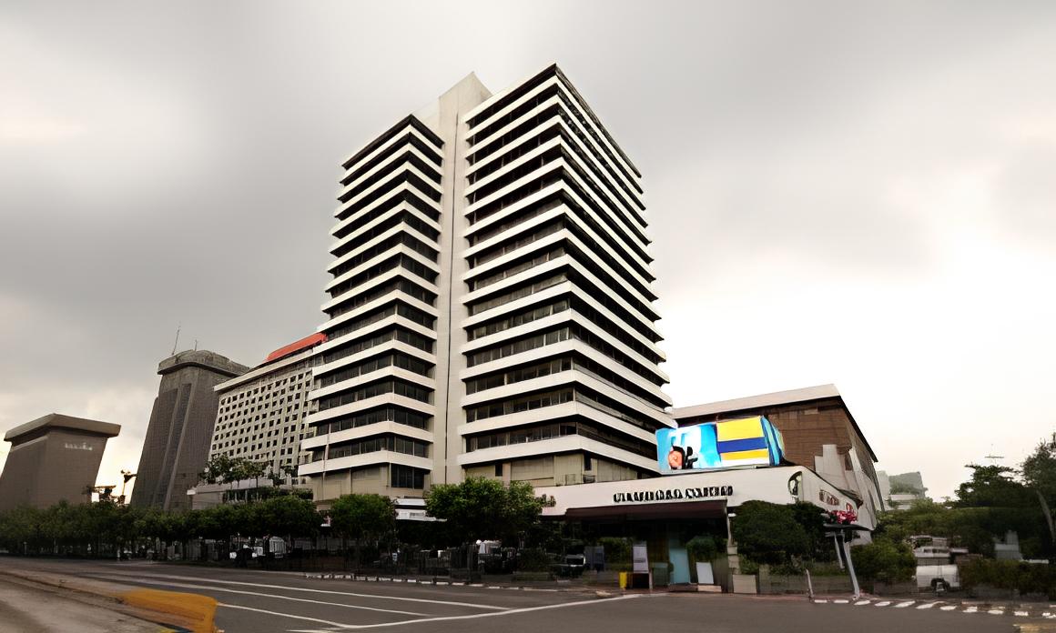 Exterior photo of modern high-rise office building representing company headquarters and corporate profile